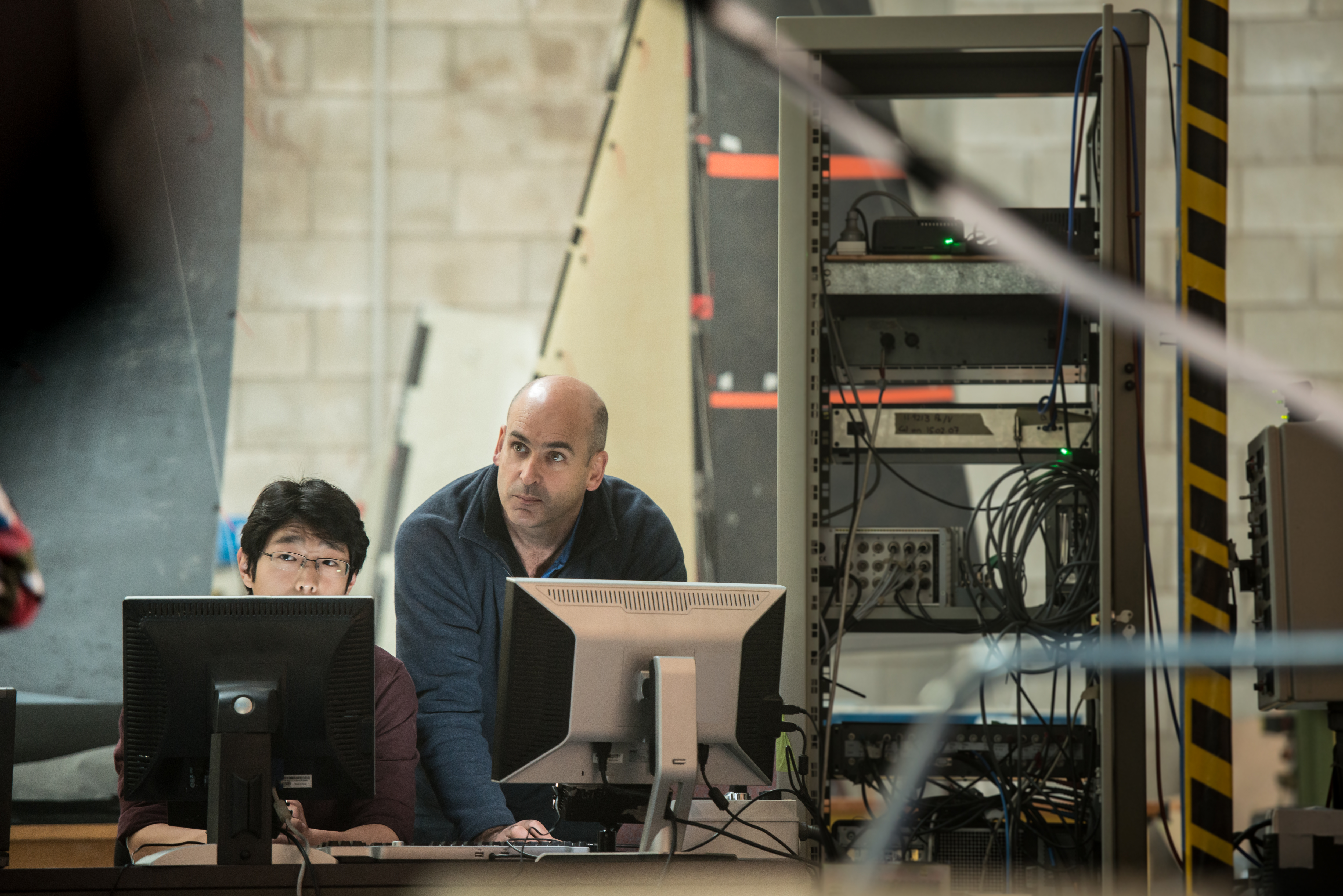 Two men at computer screens