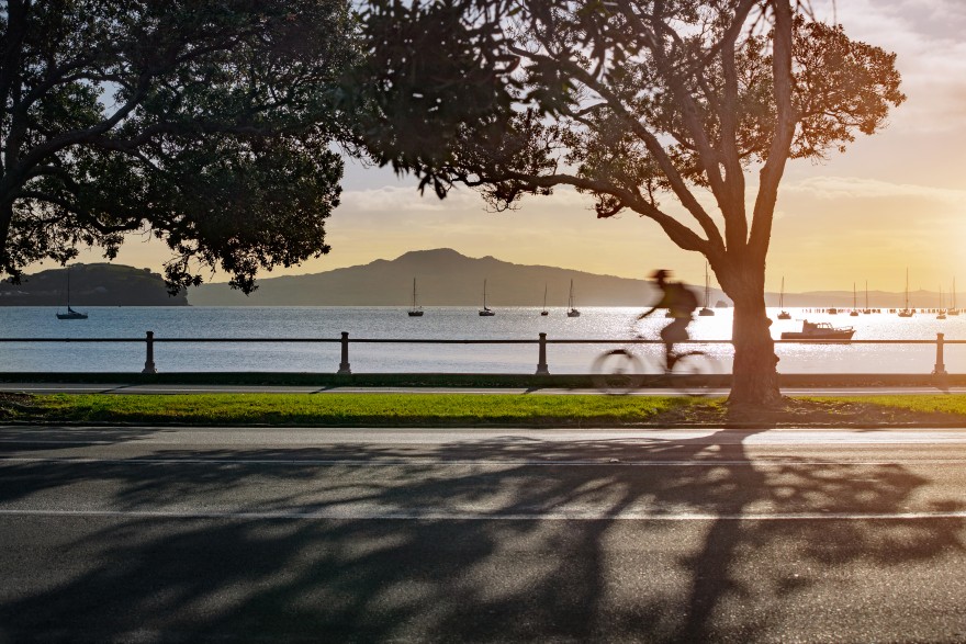 man cycling near ocean