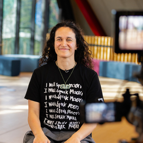 Māori woman smiling at camera